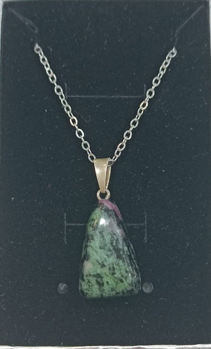 Colgante con anilla de plata variado pulido